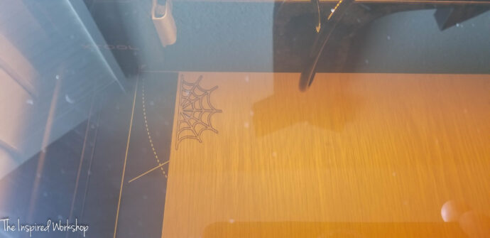 xtool m1 review - cutting a spder web shape with the laser cutter