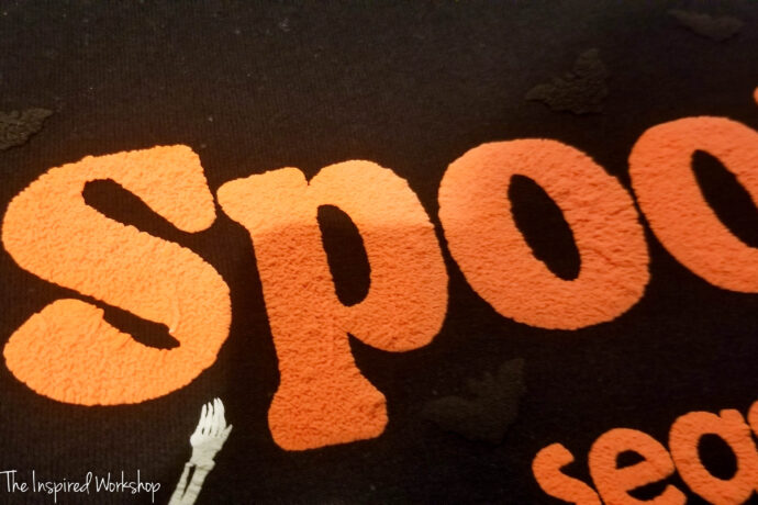 spooky made out of puff vinyl on a black sweatshirt