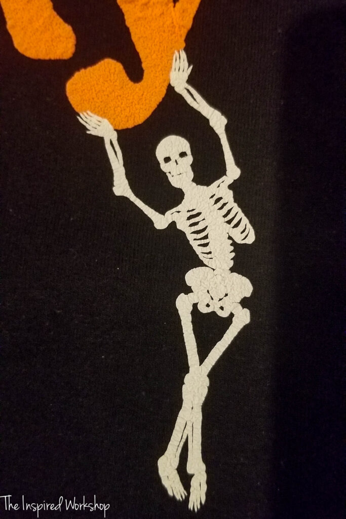 skeleton out of puff vinyl on a black sweatshirt