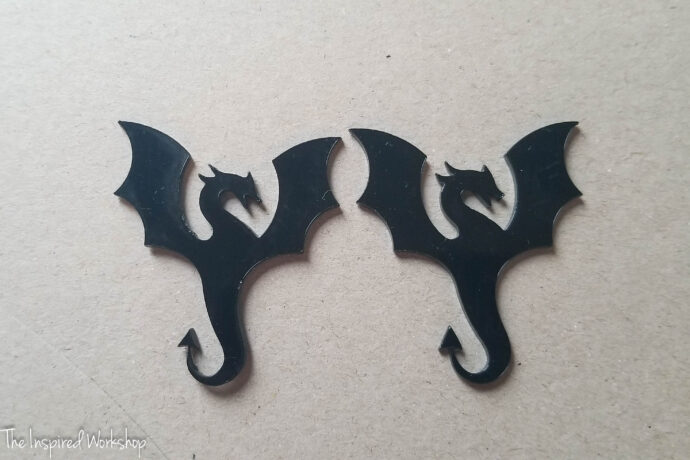 black acrylic dragons cut on the xtool m1