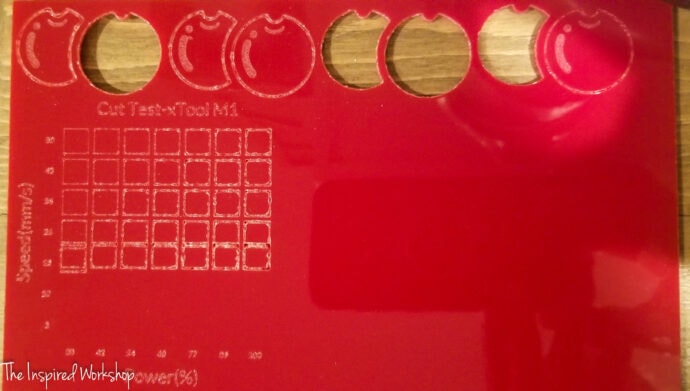 red acrylic test grid made with the xtool m1