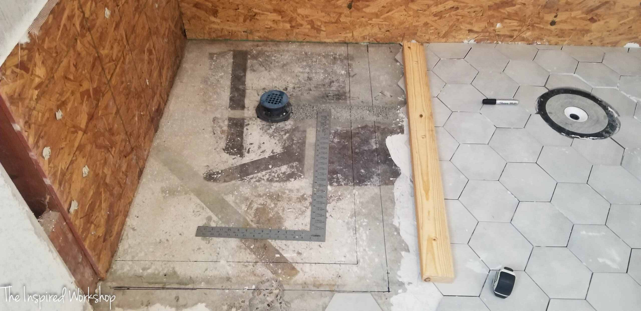 bathroom floor showing the drains 