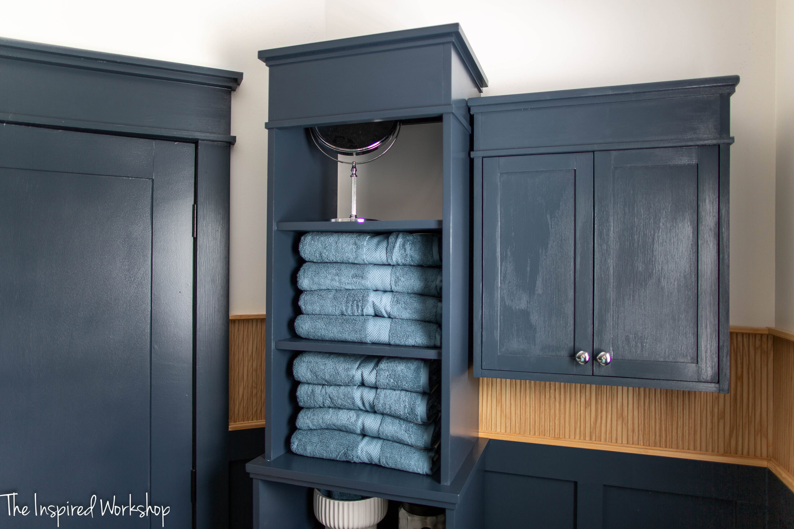 top of the linen cabinet showing the towels