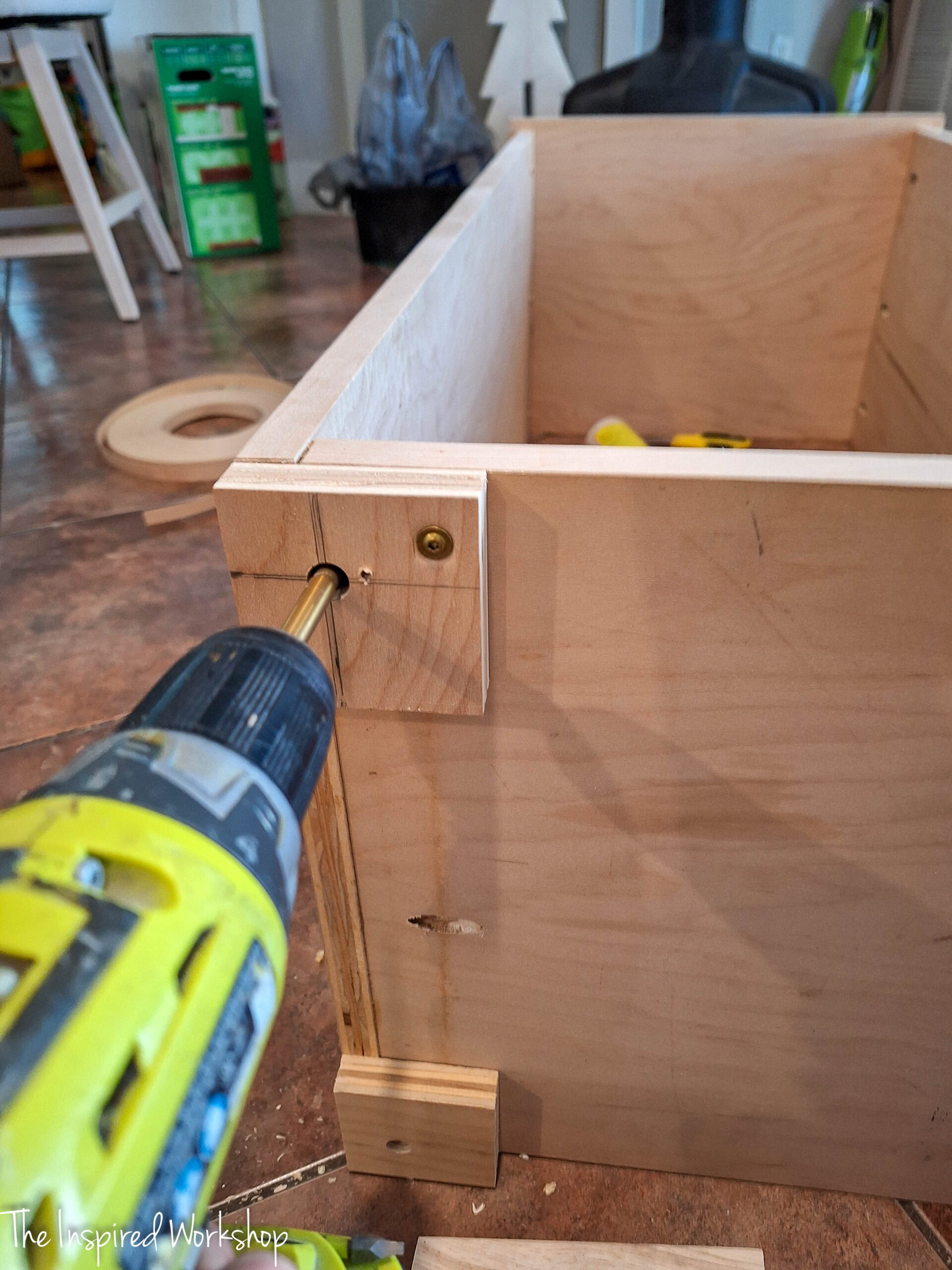 drilling into the bottom of the linen cabinet
