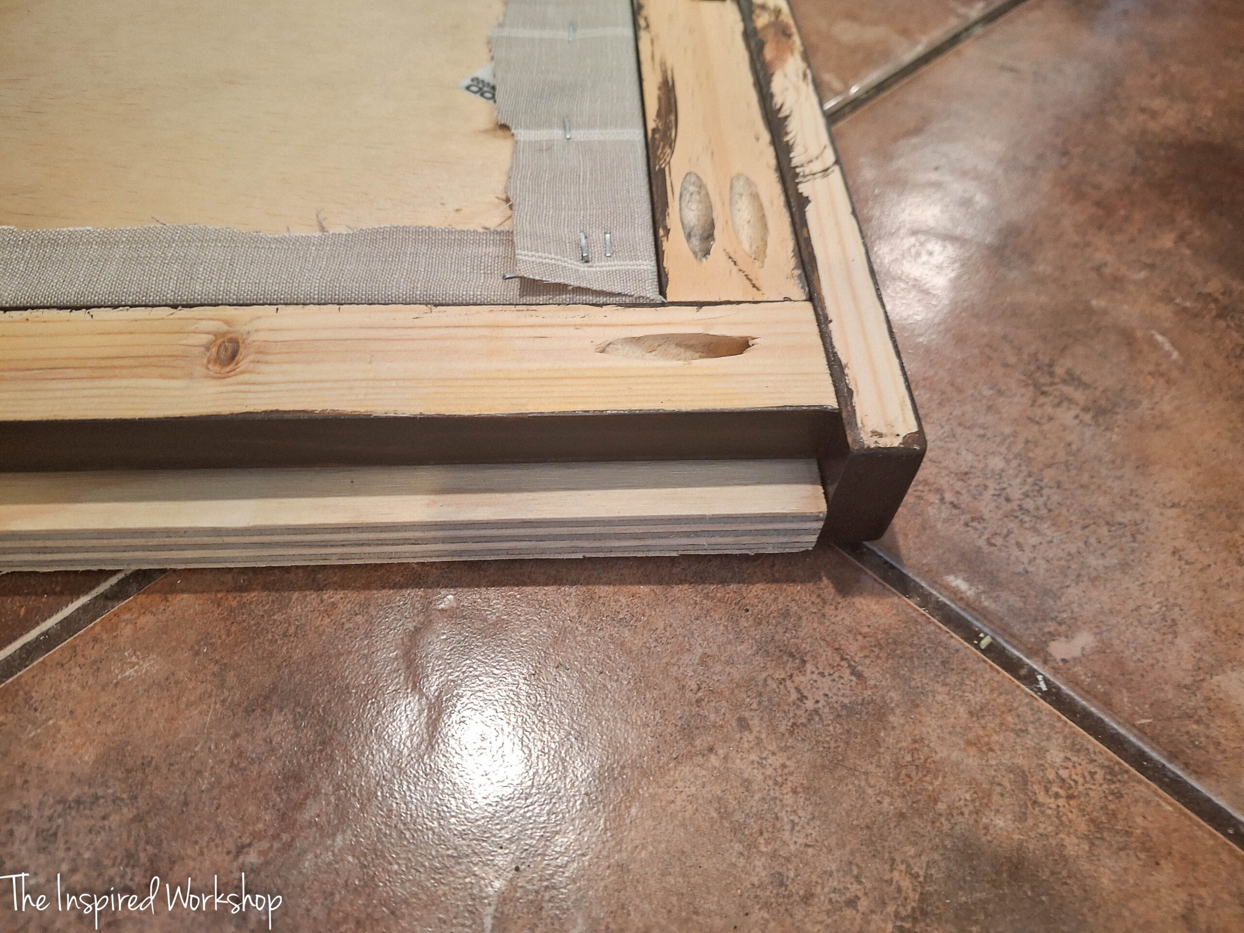 showing how to attach the boards to make the frame of the bulletin board