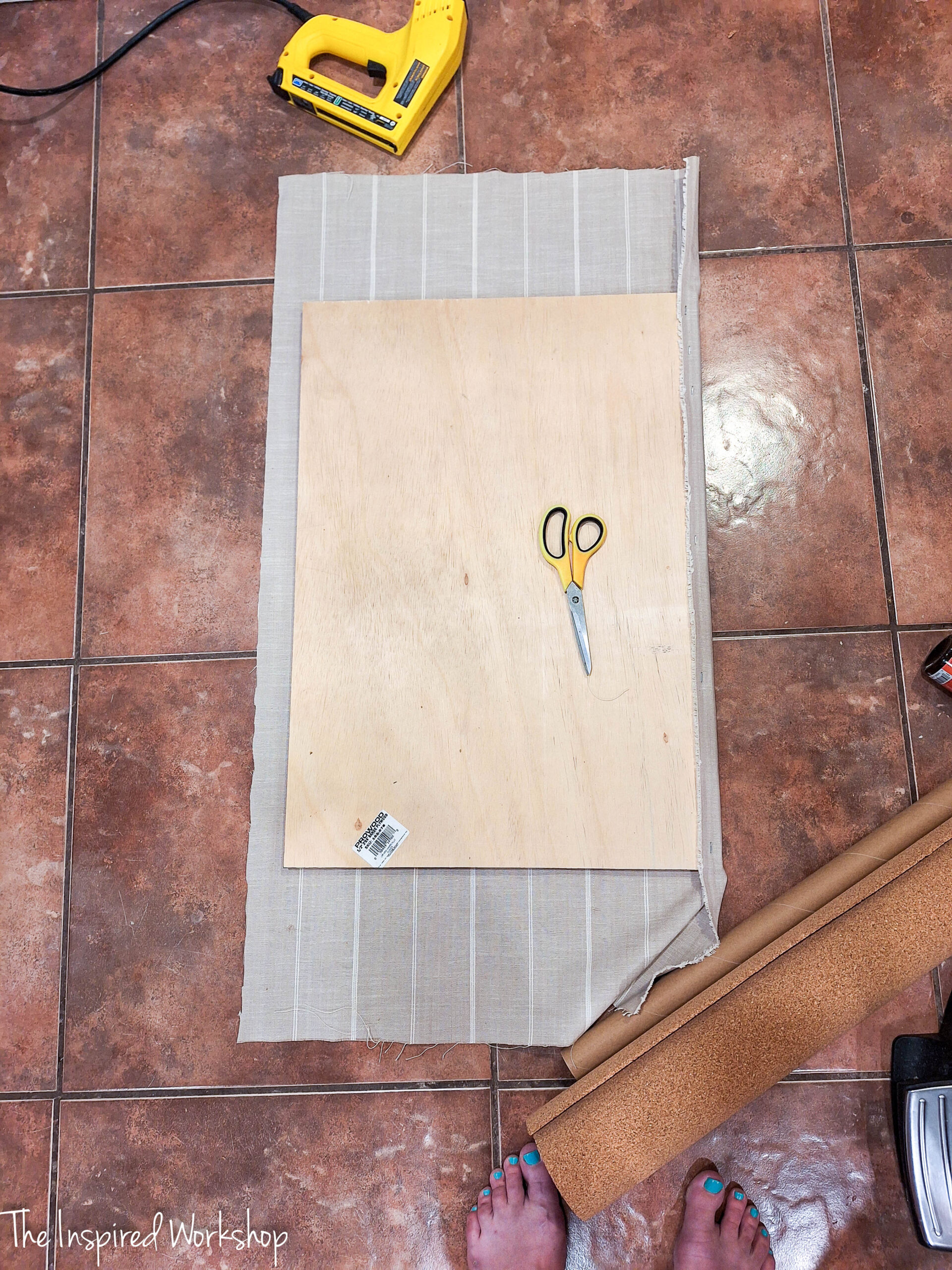 adding the fabric to the bulletin board
