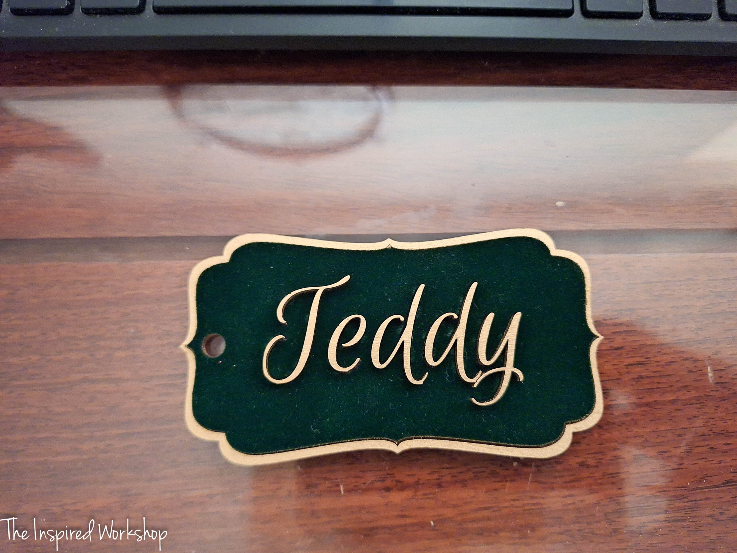 green velvet and gold stocking tag with the name "Teddy" on it