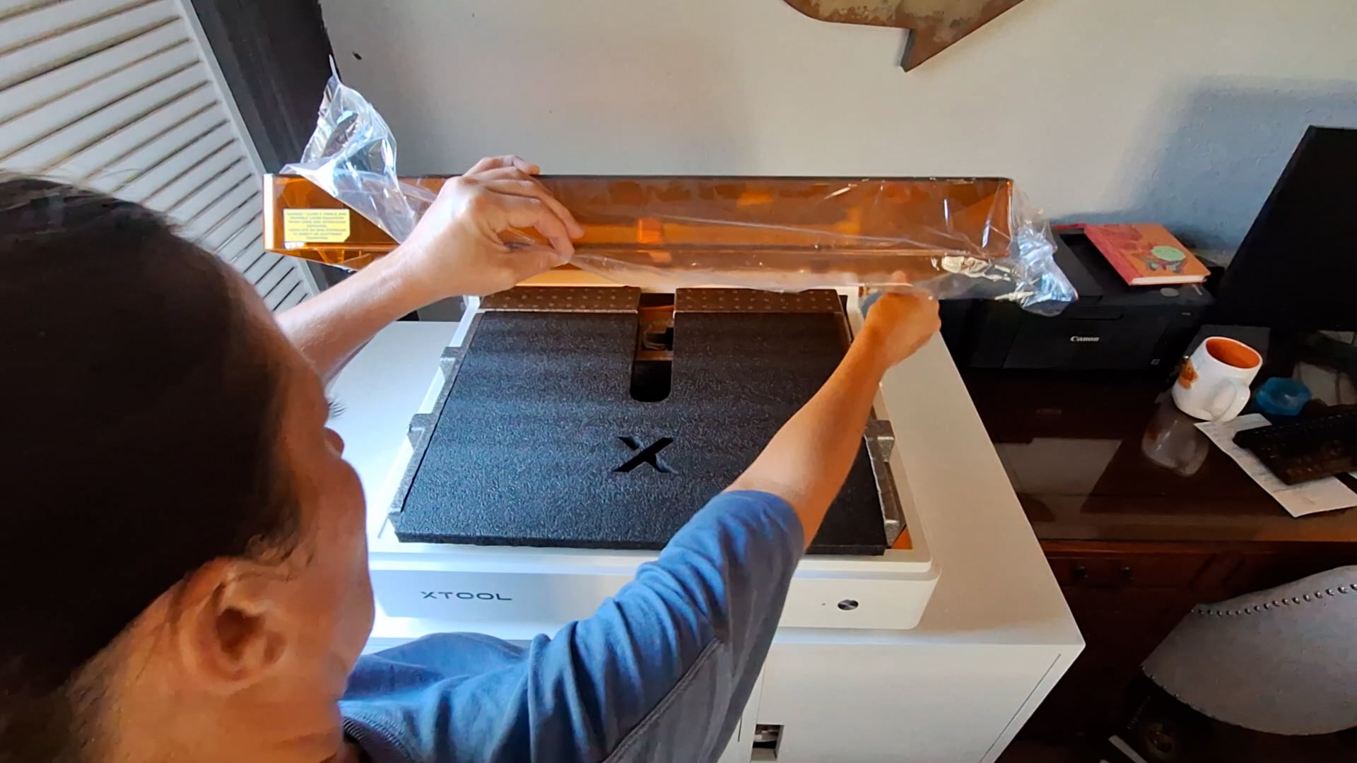 opening the xTool M2 to reveal the components inside the machine