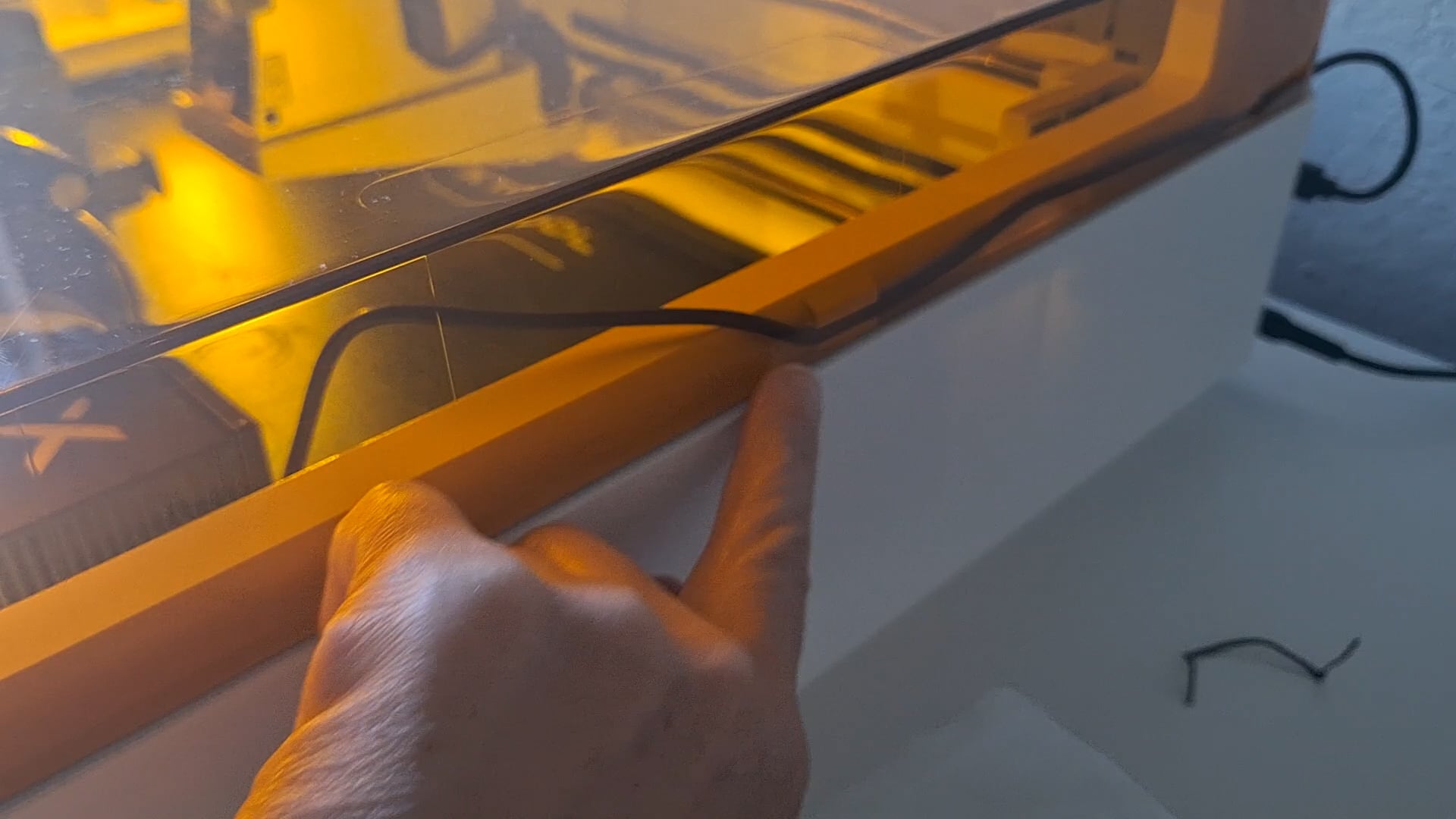 clipping the cord into place on the xtool m2